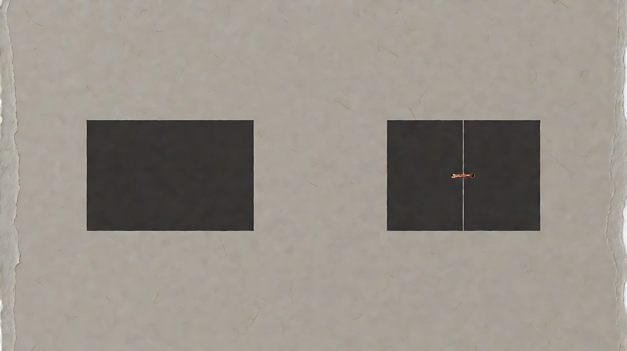 Two dark blocks of the same height. The right block is split by a thin line with a small copper mark in the seam.