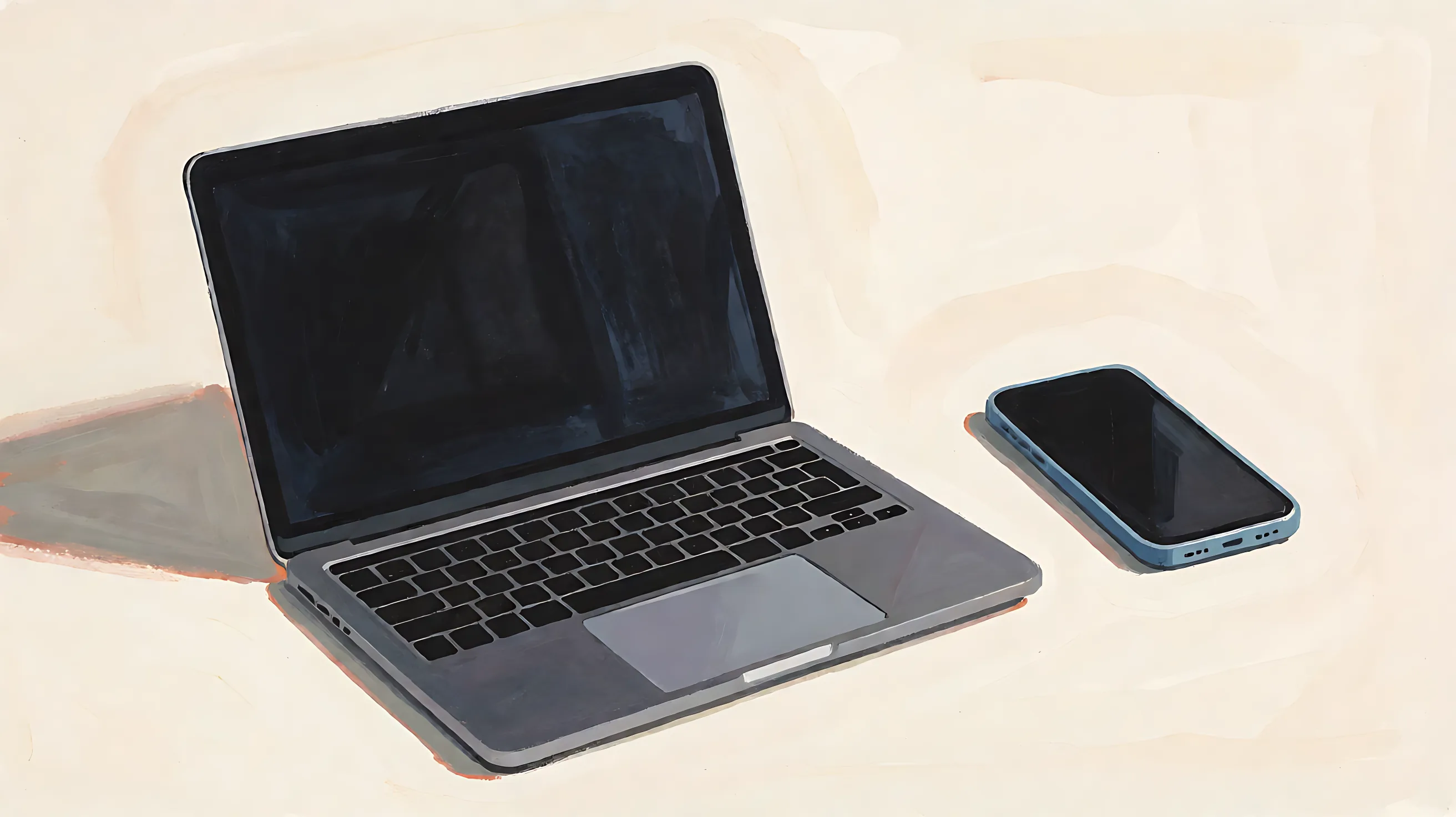 An open laptop with a dark screen beside a phone with a dark screen, with no logos and no writing
