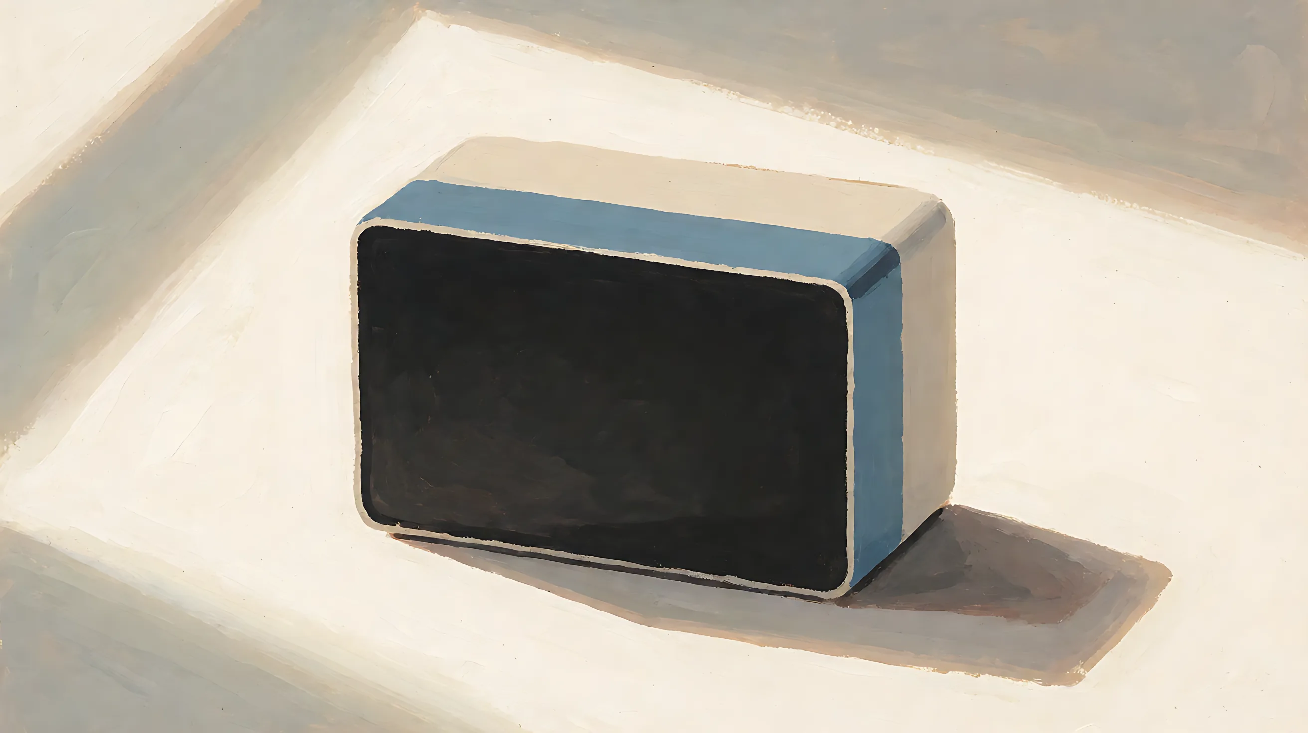A box with a solid charcoal front and a muted-blue side