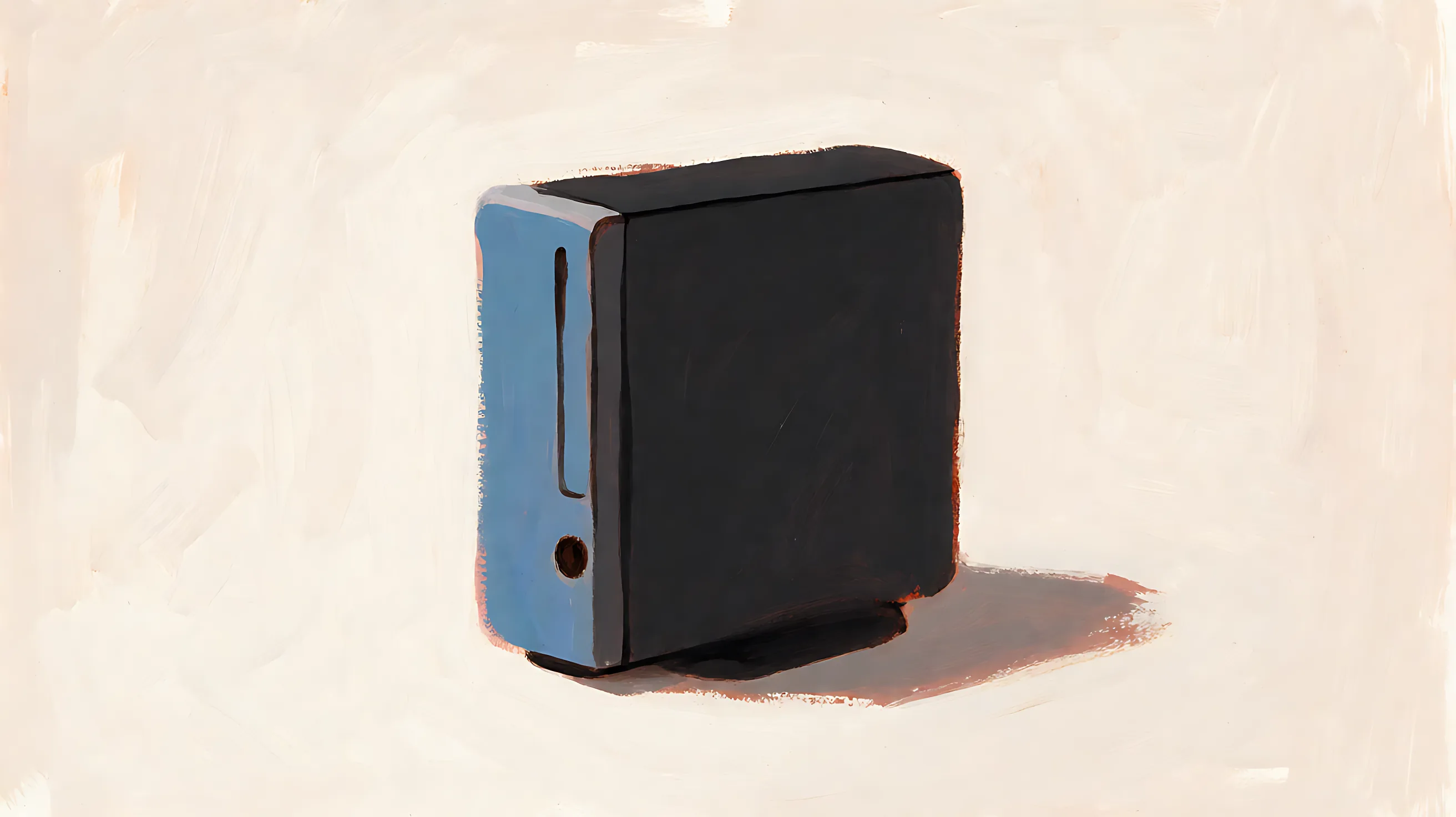 A compact desktop computer with a charcoal case and a muted-blue side