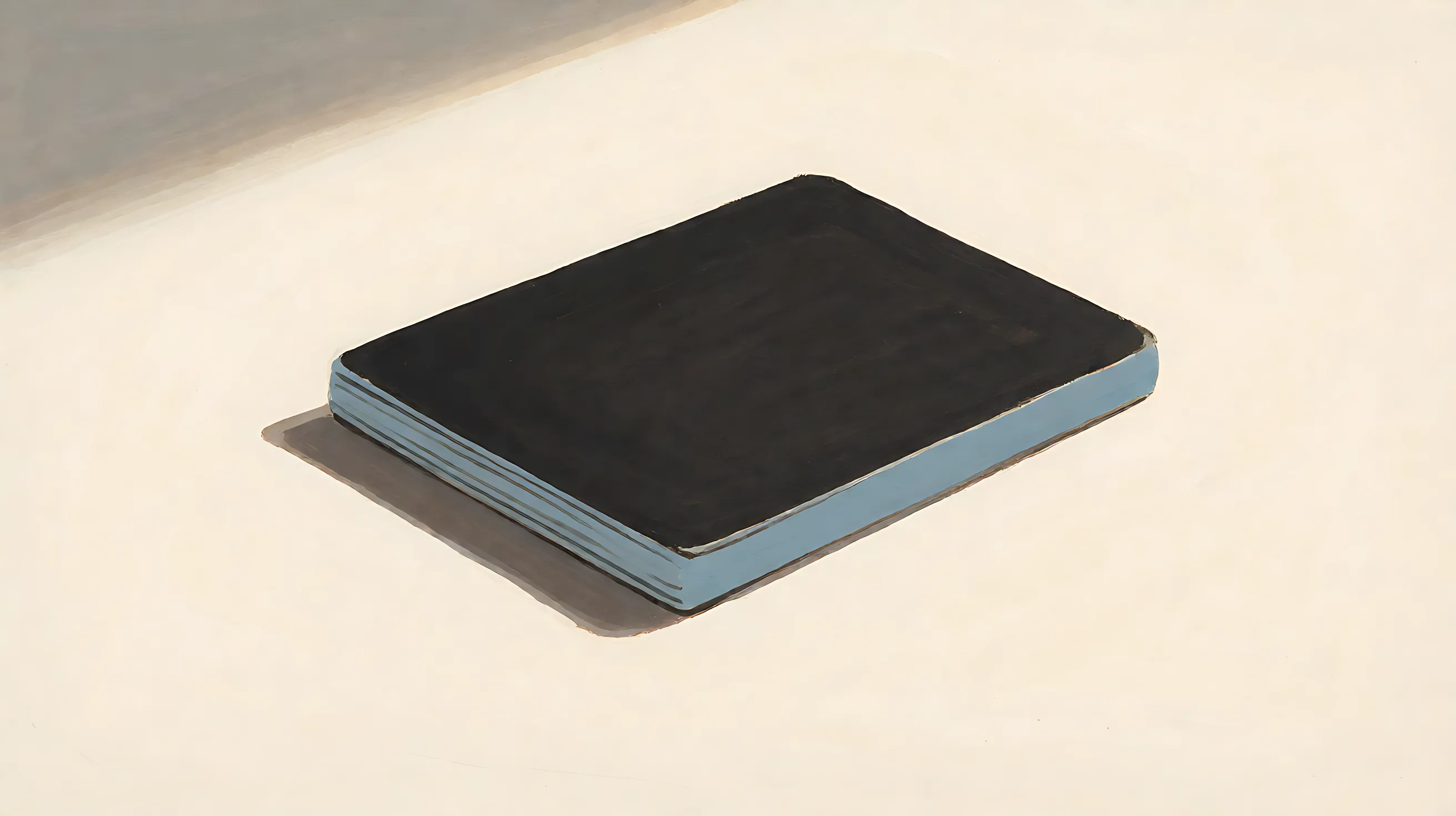A closed card, charcoal cover, muted blue edge