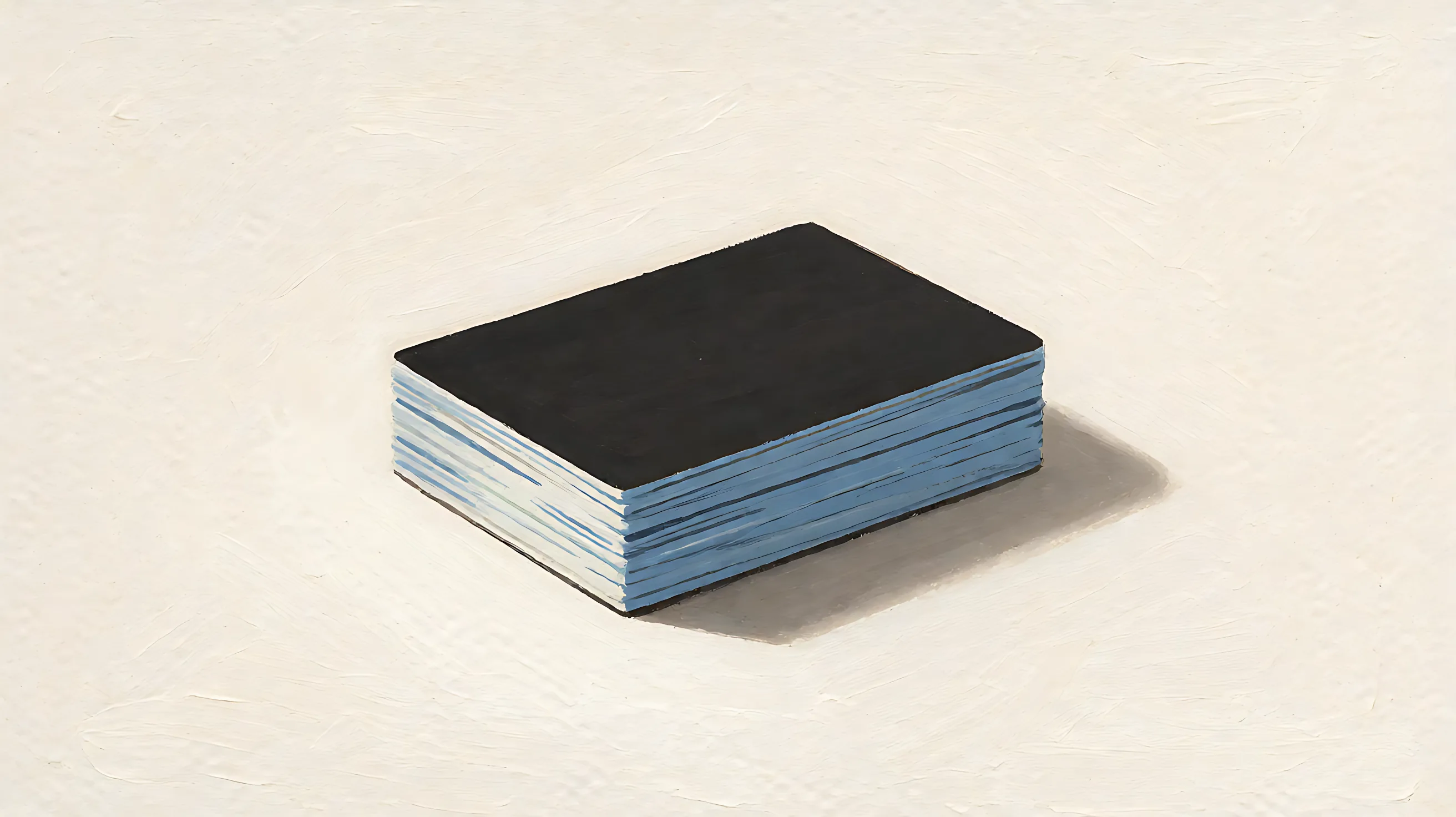 A stack of charcoal sample cards with a muted blue edge